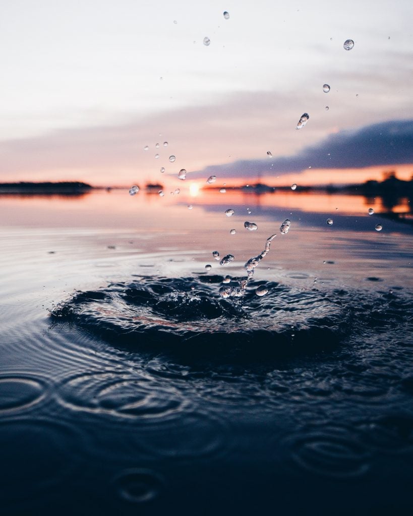 splash in water with sunset